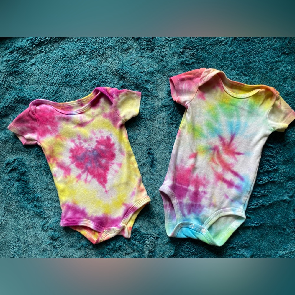 2 vibrant handmade Tie-Dye Baby Onesies
